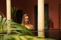 Blonde woman playing the piano. The woman is happy feeling the music