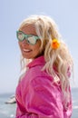 Blonde woman poses along the California Pacific Coast Highway with a poppy in her blonde hair Royalty Free Stock Photo