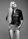 Blonde woman in ragged jeans and jacket Royalty Free Stock Photo