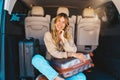 Woman is ready to travel with baggages in hand