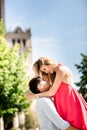 Blonde woman in red dress having fun with her man. A man holding a woman in his arms. Love story Royalty Free Stock Photo