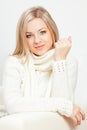 Blonde woman sitting on sofa Royalty Free Stock Photo