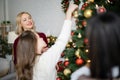 blonde woman smiling near blurred mother Royalty Free Stock Photo