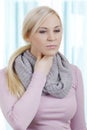 Blonde woman with sore throat