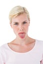 Blonde woman sticking her tongue out Royalty Free Stock Photo