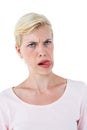Blonde woman sticking her tongue out Royalty Free Stock Photo