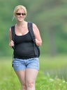 Blonde woman on a summer stroll