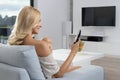 Blonde woman with tv Royalty Free Stock Photo