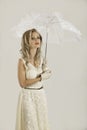 Blonde woman in vintage 50s outfit with umbrella Royalty Free Stock Photo