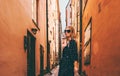 Blonde woman walking in Stockholm traveling alone Royalty Free Stock Photo