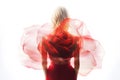 Blonde Woman Wearing a Soft Red Silk Dress Looking Like a Rose Flower Royalty Free Stock Photo