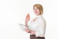 Blonde woman wearing in white blouse holding clipboard and pencil in hands, looking away and smiling