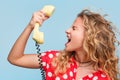 Blonde woman yelling at phone Royalty Free Stock Photo