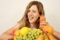 Blonde women with fresh fruits and orange juice