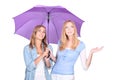 Blonde women under a umbrella