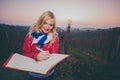 Blonde writing memories in a wineyard Royalty Free Stock Photo