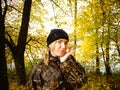 Model against the background of late autumn in the yellow forest.