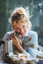 Blonde woman with a cat at breakfast time. Royalty Free Stock Photo