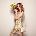 Blonde young woman in elegant floral dress Royalty Free Stock Photo