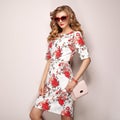 Blonde young woman in floral spring summer dress Royalty Free Stock Photo