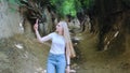 Blonde young woman making photos on smartphone in magical Roots Gorge Royalty Free Stock Photo