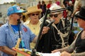 Blondie King Neptune Chris Stein speaking to the microphone at the 35th annual Mermaid Parade