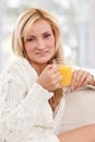 Blondie woman with a glass of orange juice