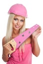 Blondie woman with pink tool Royalty Free Stock Photo