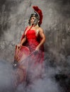 Blong roman woman in red dress.