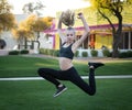 Blong Teen Girl Jumping in the Park