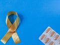 Blood cancer ribbon with pills Royalty Free Stock Photo