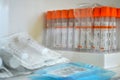 Blood collection tubes with orange caps and syringes are on the shelf Royalty Free Stock Photo