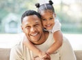 Blood doesnt make a family love does. a father and daughter bonding together at home.