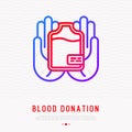 Blood donation concept: blood bag in hands