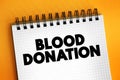 Blood Donation is a voluntary procedure that can help save lives, text on notepad