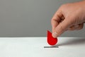 Blood donor. Man puts drop of blood in the piggy bank as donation. Concept donate blood save life. Copy space for text. Royalty Free Stock Photo