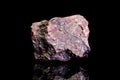 Blood iron or red iron ore, raw rock on black background, mining and geology