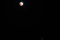 Blood Moon 2018: Longest Total Lunar Eclipse of Century in july, Moon and Mars planet opposition. Night photography. Telescopic Royalty Free Stock Photo