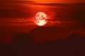 blood moon on night red sky back over silhouette mountain Royalty Free Stock Photo