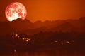 blood moon on night red sky back over silhouette mountain Royalty Free Stock Photo