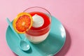 Blood Orange Citrus Panna Cotta on Pink Background Royalty Free Stock Photo