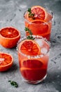 Blood Orange Margarita cocktail with ice and thyme