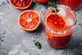 Blood Orange Margarita cocktail with ice and thyme