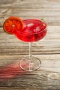 Blood Orange Margarita cocktail with ice and thyme on old wooden backgorund Royalty Free Stock Photo