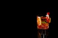 Blood Orange Margarita coctail with ice and mint on black Royalty Free Stock Photo