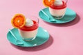 Blood Orange Panna Cotta Dessert on Pink Background