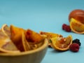 Blood orange segments and berries on a blue background. Healthy food concept Royalty Free Stock Photo