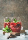 Blood orange and strawberry summer Sangria in glasses, copy space Royalty Free Stock Photo