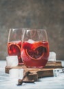 Blood orange and strawberry summer Sangria in glasses with ice Royalty Free Stock Photo