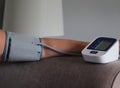 Adult arm and blood pressure machine in the home .record reading for doctors Royalty Free Stock Photo